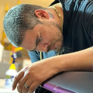 Greg, owner of Precision Wraps Jax, in the shop